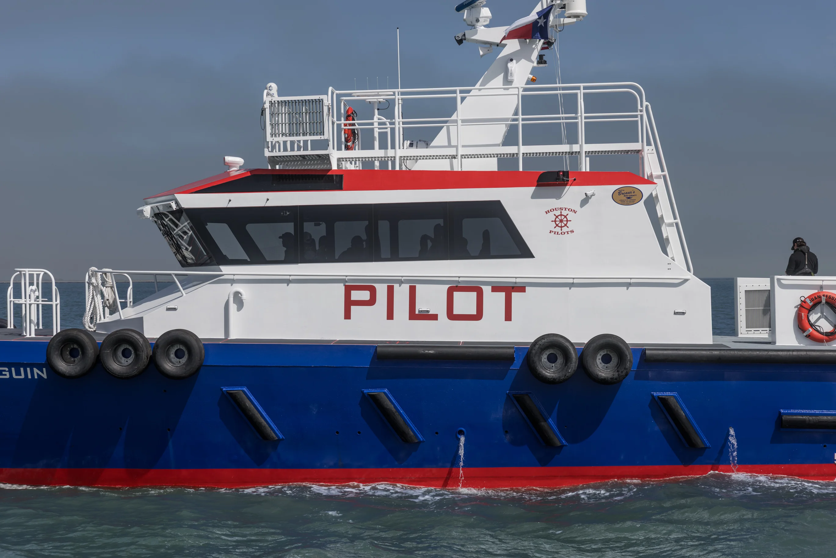 Houston Pilots vessel underway on open water, showcasing Breaux's Bay Craft craftsmanship